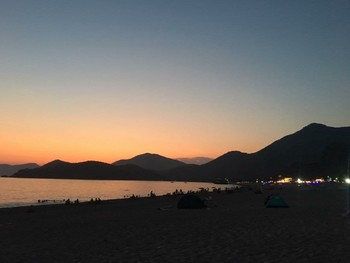 &nbsp; / Amazing sunset on the beach and people enjoying it