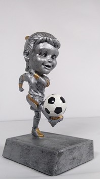 Cute Soccer Bobblehead / A highly realistic bobblehead featuring a non binary individual kicking a soccer ball. Photographed in Atlanta, Georgia