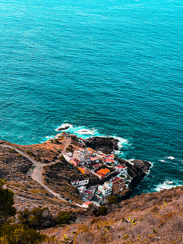 &nbsp; / Ocean, waves &amp; a coastal village.