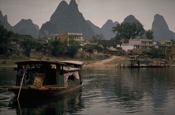 Guilin Limestone Peaks / Guilin is flat enough to cycle around and then these magnificent limestone peaks rise up in front of you.

A cruise down the river, from Guilin to Yangshuo, passes through some of China's most magnificent scenery.

Nature has spent 70 million years perfecting the sculptures around this part of the Li River; revealing a landscape that is truly awesome.

https://travelnotes.org/pics/Asia/06-Guilin_Limestone_Peaks.htm