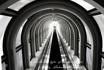 Light at the end of the tunnel / Umeda Sky Building escalator.