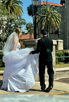 &nbsp; / Bride and Bridegroom’s trying to avoid a puddle