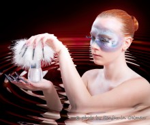 In the water / Photo of a girl with long fingernails and trendy makeup, she holds in the hands a jar of cream