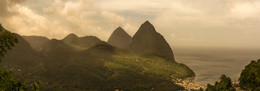 Pitons / The Pitons are two mountainous volcanic plugs, volcanic spires, located in Saint Lucia. The Gros Piton is 771 metres (2,530 ft) high, and the Petit Piton is 743 metres (2,438 ft) high; they are linked by the Piton Mitan ridge. The Pitons are a World Heritage Site 2,909 ha (7,190 acres) in size and located near the town of Soufrière.