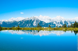 Water reflection / Mountains reflected in water. Close by Seefeld in Tirol.