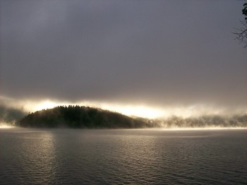 The Other Side / land emerges out from the early morning mists of Canim Lake BC Canada
