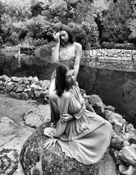 &nbsp; / moody image of two young ladies in outdoor scene-a black and white composition