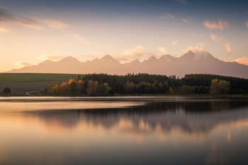 &nbsp; / Sunset at the small lake (pond) in Slovakia with High Tatras in the background.