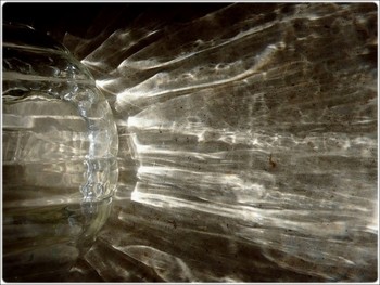 &nbsp; / light refractions through water glass