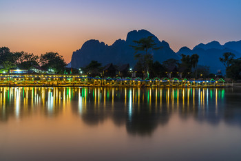 Sunset reflection on the river Nam Song, Vang Vieng, Laos / Sunset reflection on the river Nam Song, Vang Vieng, Laos