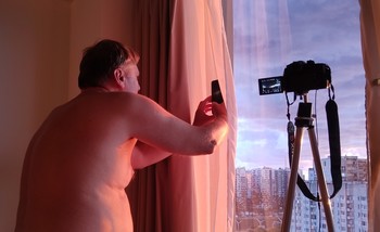 Человек с фотоаппаратом / Фотография заката